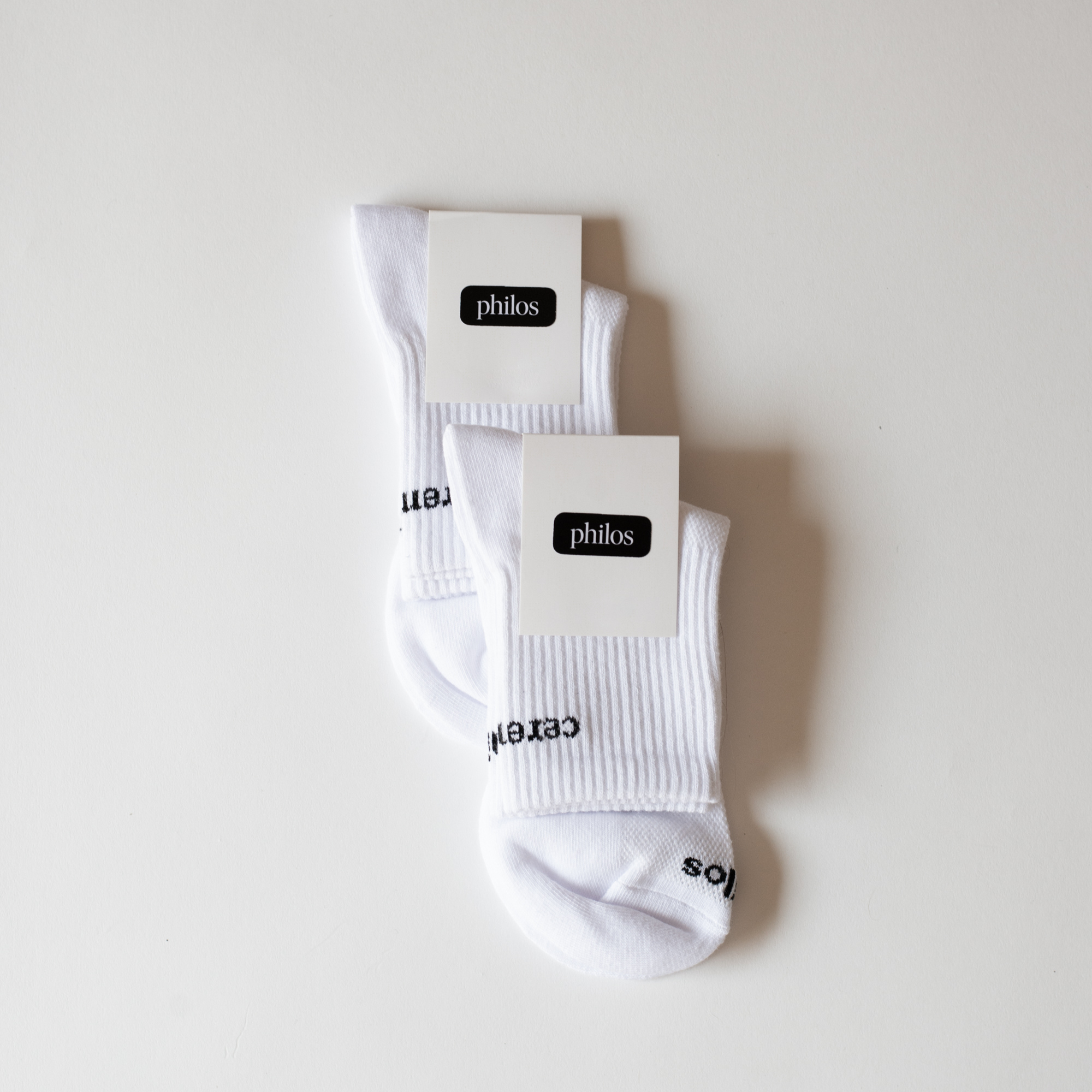 Pack of 2 Philos running socks in white, featuring soft arch compression and knit mesh for natural breathability, designed for running.