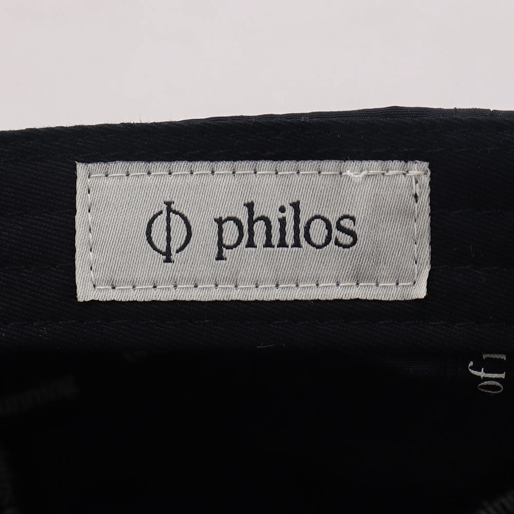 Close-up of the Philos logo inside the running cap.