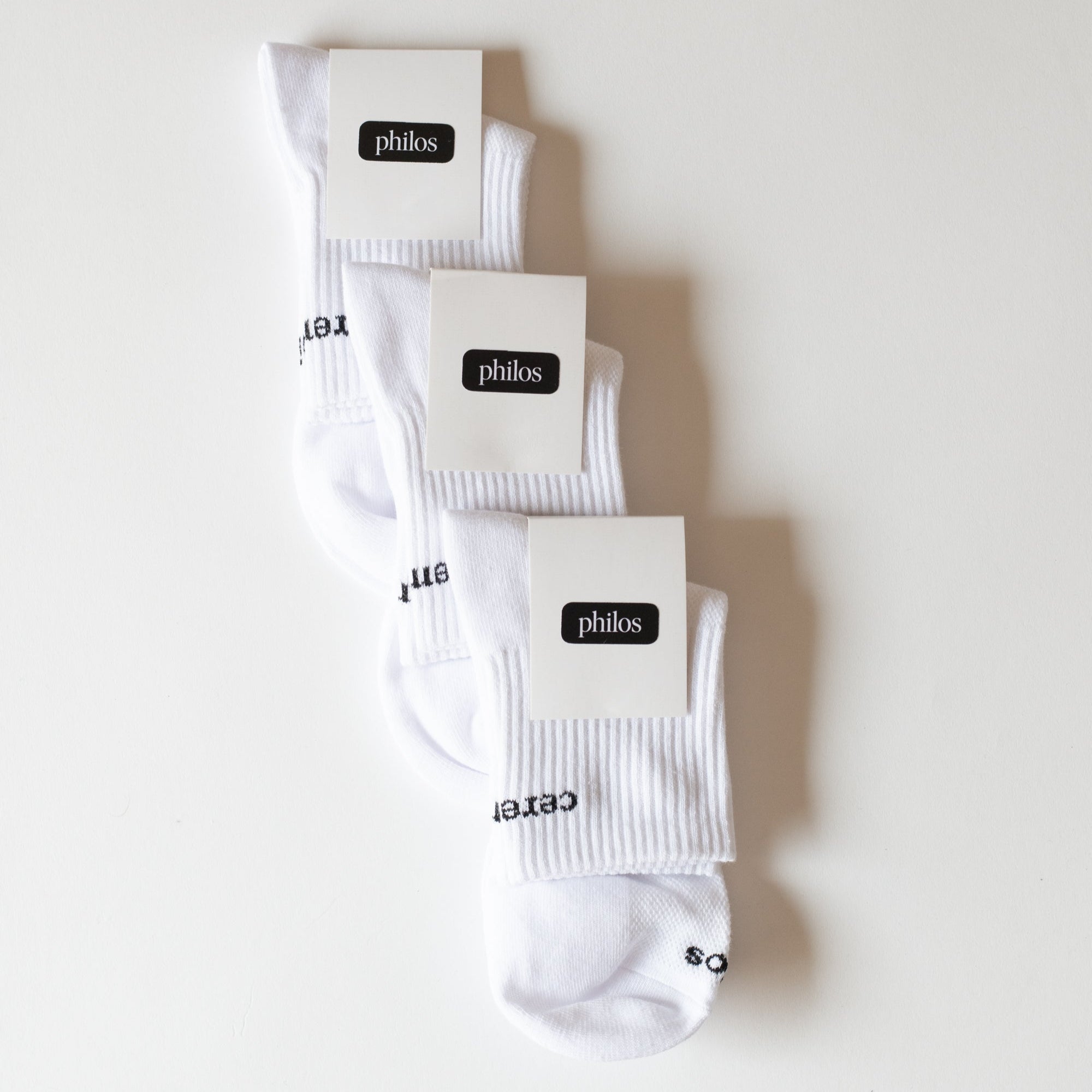 Pack of 3 Philos running socks in white, featuring soft arch compression and knit mesh for natural breathability, designed for running.