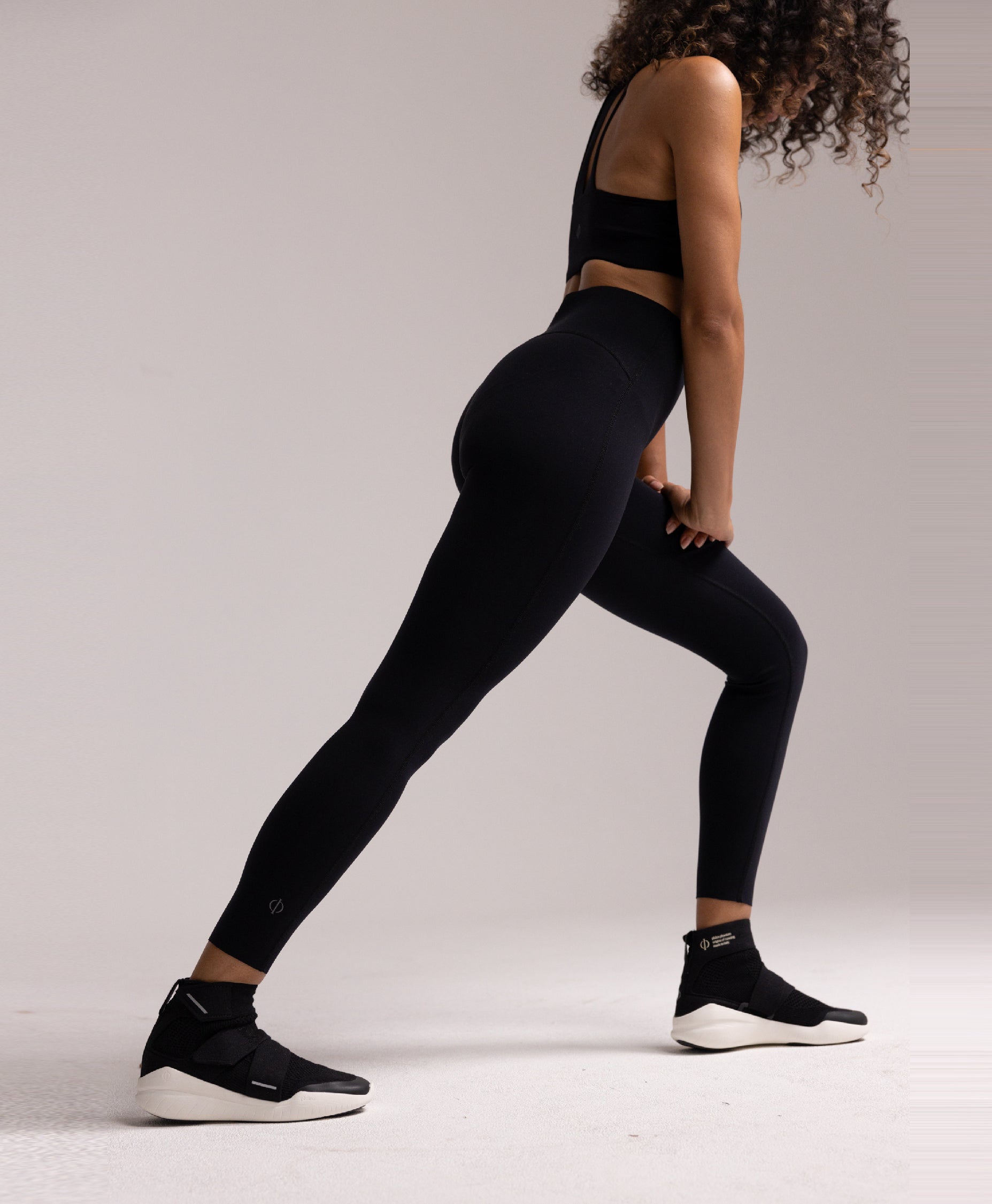 Side view of the Philos Armor Running Tights, showing the breathable 4-way stretch fabric and laser-cut hems, designed for a sleek, comfortable fit.